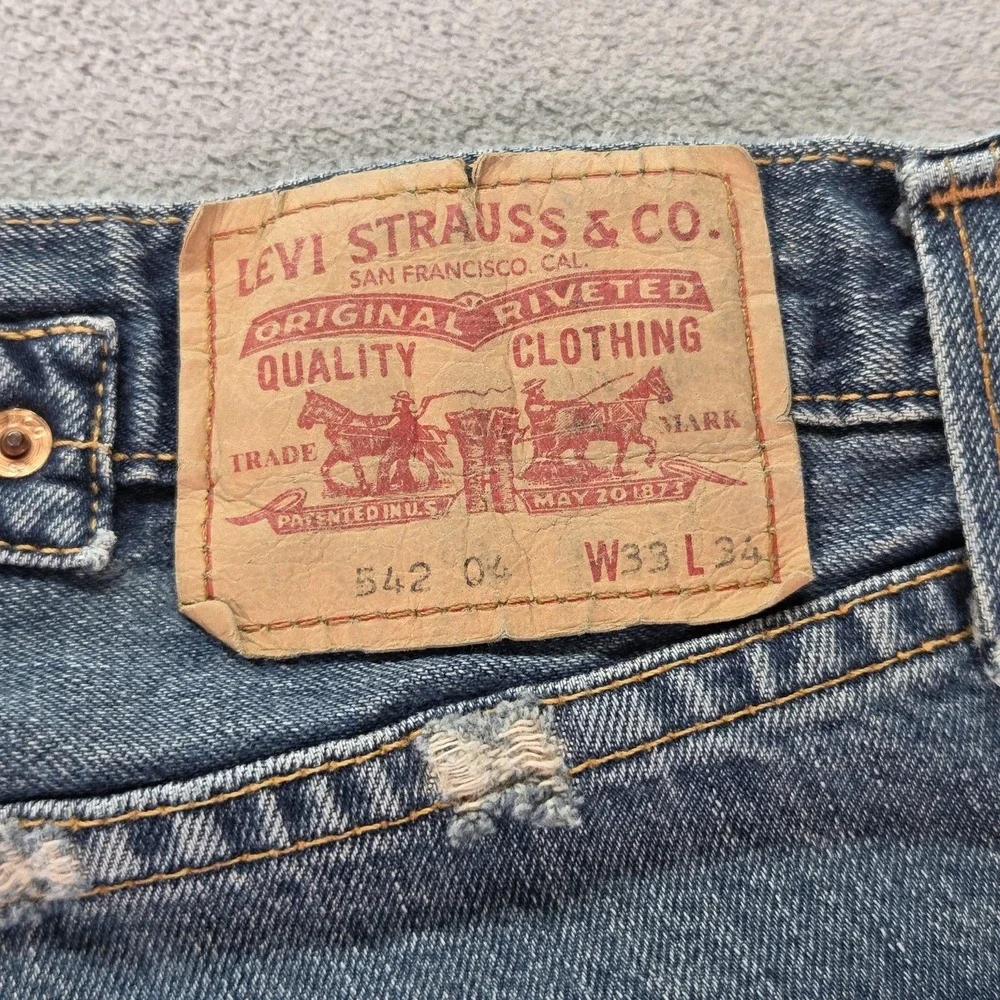 Levis 542 Jeans Mens Blue Med Wash Relaxed Buckle Back Patched Fits 34x28